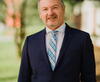 Michael McKnight wearing a suit and tie